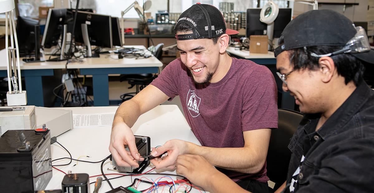 Electrical engineering students work on a project