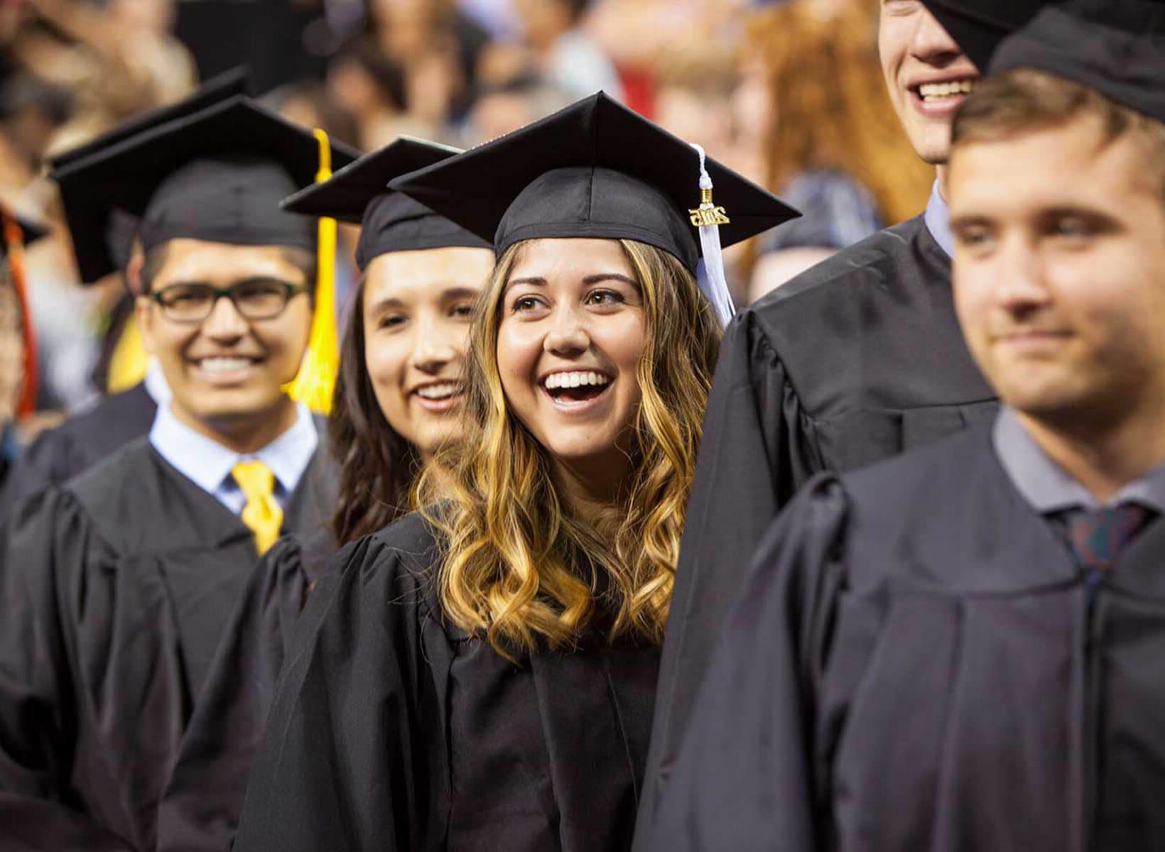 SPU undergraduate students in their caps and gowns during Commencement