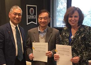 Sharleen, and Dean Kato with President Samuel Chang.